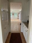 cherry floor white kitchen
