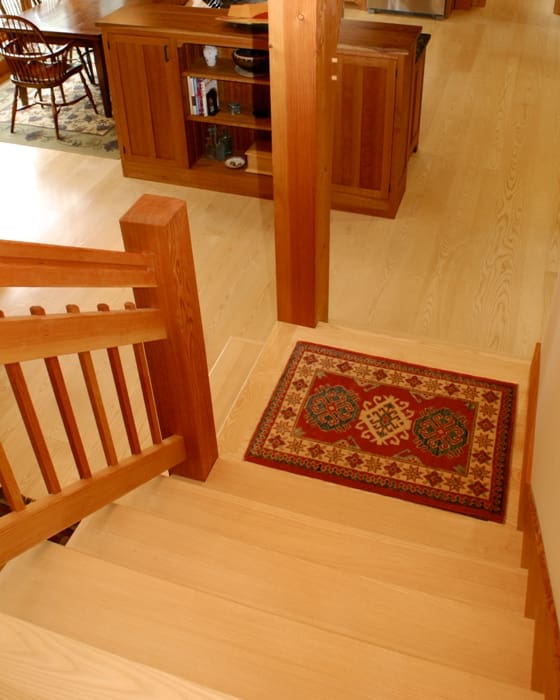 Clear grained pale wood Ash floors contrast nicely with the warm hues of Douglas Fir timbers and trim.