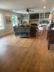 open concept home with wide board wood flooring throughout