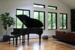 Piano room with live sawn white oak plank flooring