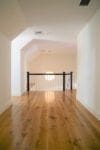 View of live sawn white oak flooring in a hallway showing the long plank lengths
