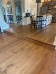 open concept kitchen with live sawn white oak flooring throughout